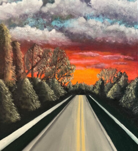 Estrada com árvores ao redor durante um por do sol